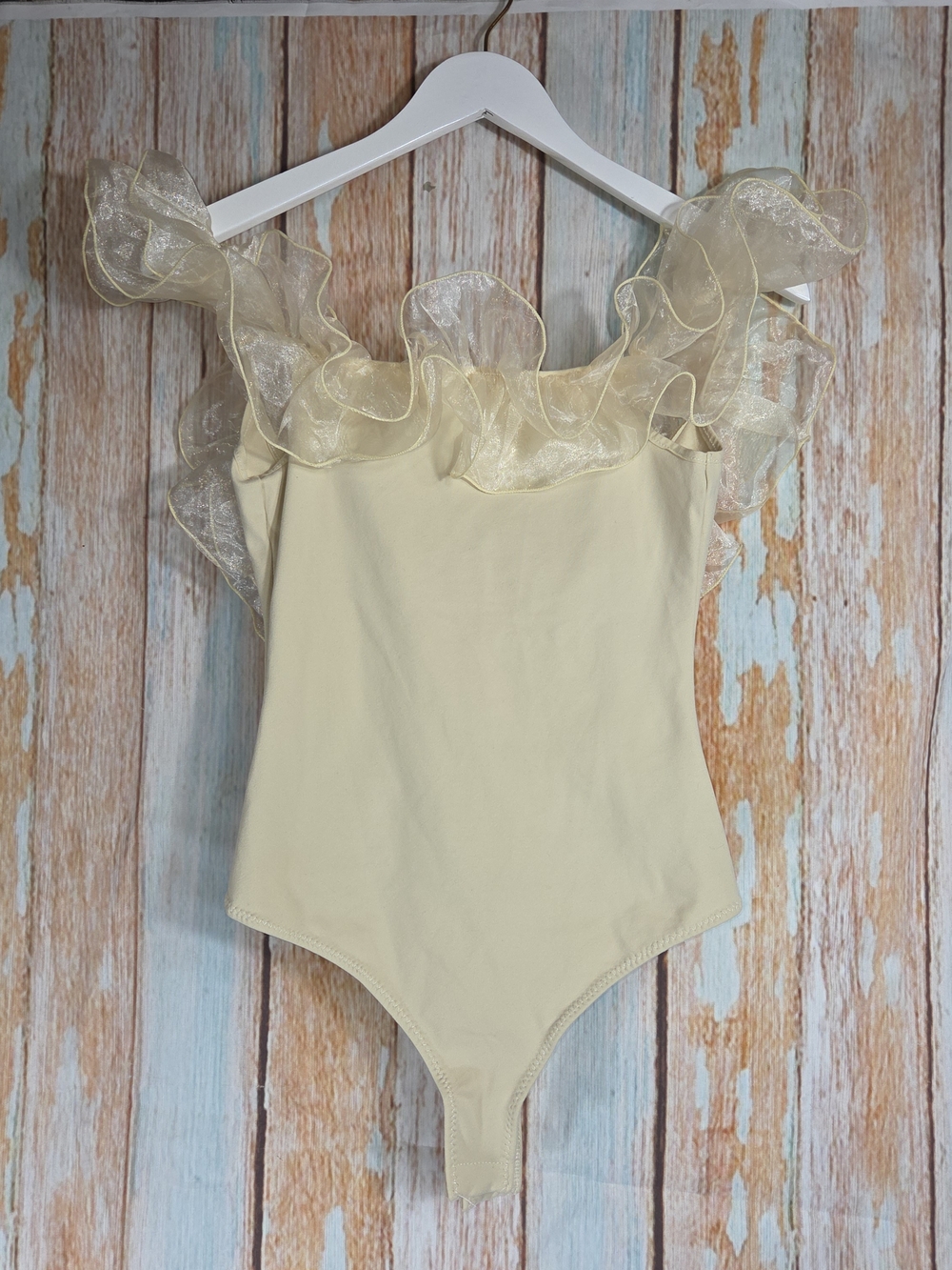 Free People Ruffled Body Suit In Tan Color.